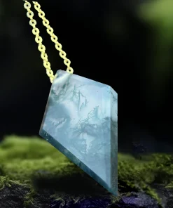 Rear view of faceted kite moss agate pendant on moss