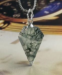 Hand-cut moss agate arrow pendant with pointed faceted outline and silver-colored loop