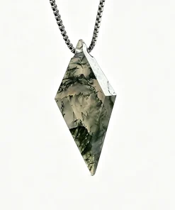 Faceted kite moss agate pendant with silver-colored box chain on an ivory background