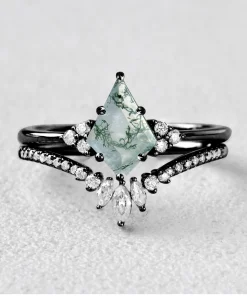 Pear moss agate ring set displayed in a black metal color