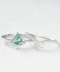 Pear moss agate ring set displayed in a white metal color