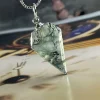 Prismatic moss agate pendant with faceted pointed outline and silver-colored pendant loop