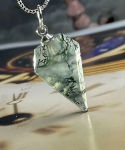 Prismatic moss agate pendant with faceted pointed outline and silver-colored pendant loop