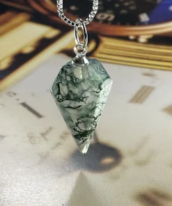 Prismatic moss agate pendant showing green mineral inclusions in direct light