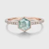 Front view of hexagon moss agate ring with rose-gold-colored bezel and clear accent stones