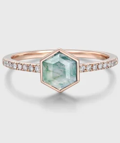 Front view of hexagon moss agate ring with rose-gold-colored bezel and clear accent stones