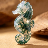 Front view of hand-carved moss agate seahorse pendant necklace