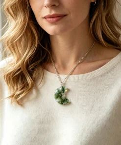 Crescent moon moss agate necklace worn with an ivory top