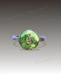 Front design rendering of donut moss agate ring with open circular gemstone