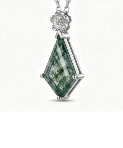 Angled view of flower moss agate pendant showing prongs and gemstone setting