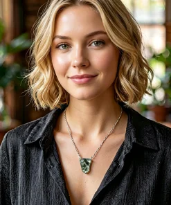 Geometric shield moss agate necklace worn with a black shirt