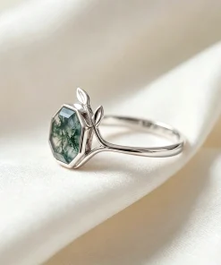 Side view of hexagon moss agate leaf ring showing gemstone setting and band
