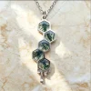 Honeycomb moss agate pendant with five hexagonal stones and a silver-colored chain