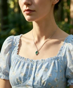 Kite moss agate necklace worn with a blue floral top