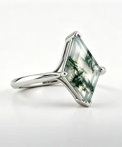 Angled view of kite moss agate ring showing the raised geometric setting