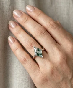 Kite moss agate ring worn on a hand