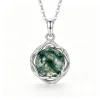 Round moss agate pendant surrounded by an organic vine-like metal frame
