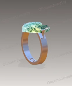 Side design rendering of heart moss agate ring showing raised prong setting