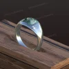 Design rendering of moss agate signet ring with broad polished shoulders and an engraved initial