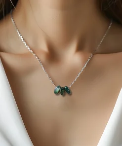 Three round moss agate disc necklace worn with an ivory top
