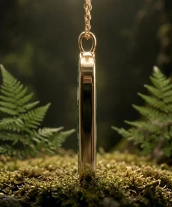 Side profile of Forest Gate moss agate pendant in gold