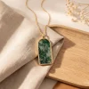 Forest Gate moss agate pendant necklace styled on ivory fabric