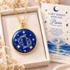 Pisces zodiac necklace featuring a polished natural lapis lazuli pendant with gold Pisces constellation design, displayed in an ivory jewelry box with a matching zodiac gift card