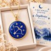 Sagittarius zodiac necklace featuring a polished natural lapis lazuli pendant with gold Sagittarius constellation design, displayed in an ivory jewelry box with a matching zodiac gift card