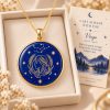 Virgo zodiac necklace featuring a polished natural lapis lazuli pendant with gold Virgo constellation design, displayed in an ivory jewelry box with a matching zodiac gift card