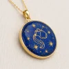 Front angled view of Aquarius lapis lazuli pendant with gold-colored water-bearer and star motifs