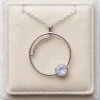 Front view of Quiet Ripple necklace with an open circular pendant and round moonstone