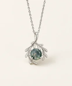 Front view of Botanical Embrace moss agate necklace with sculpted leaf surround
