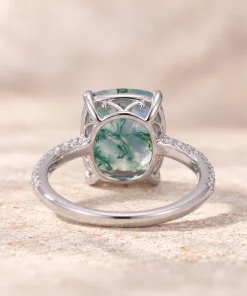 Back view of moss agate ring showing the open setting and accent-stone shoulders