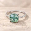 Front view of cushion-cut moss agate ring with green branching patterns and four prongs