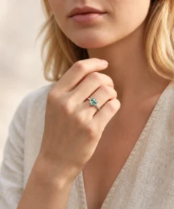 Cushion-cut moss agate ring worn with a cream linen outfit