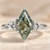Front view of kite moss agate ring with white gold leaf details and lab-grown diamond accents