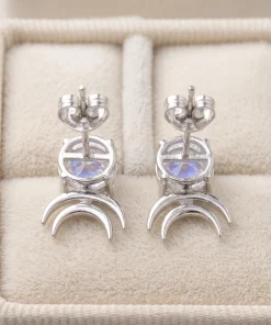 Back view of moonstone double-crescent studs with open settings and butterfly backs