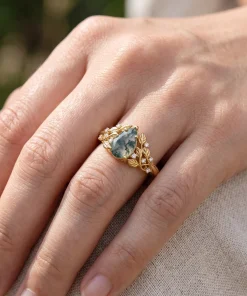 Sylvan Leaf pear moss agate ring worn on a hand
